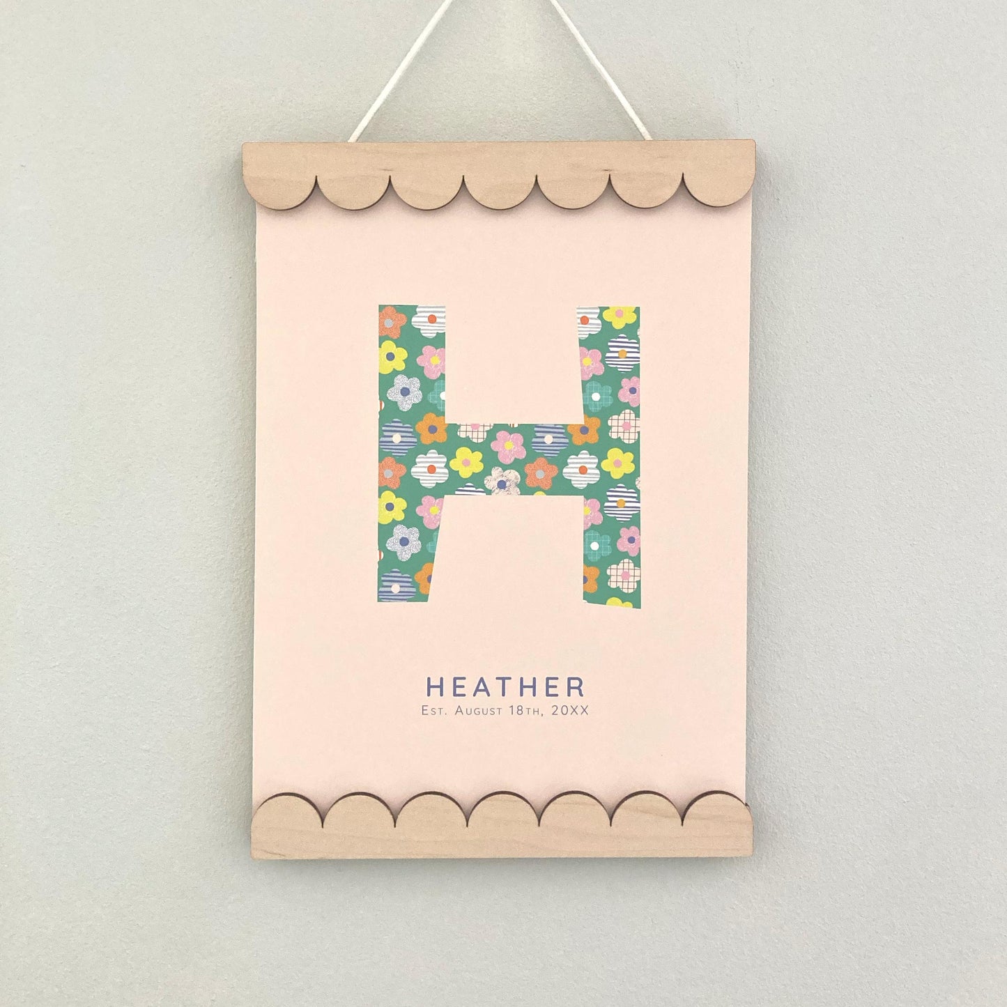 A4 Scallop edged poster hanger with H name print