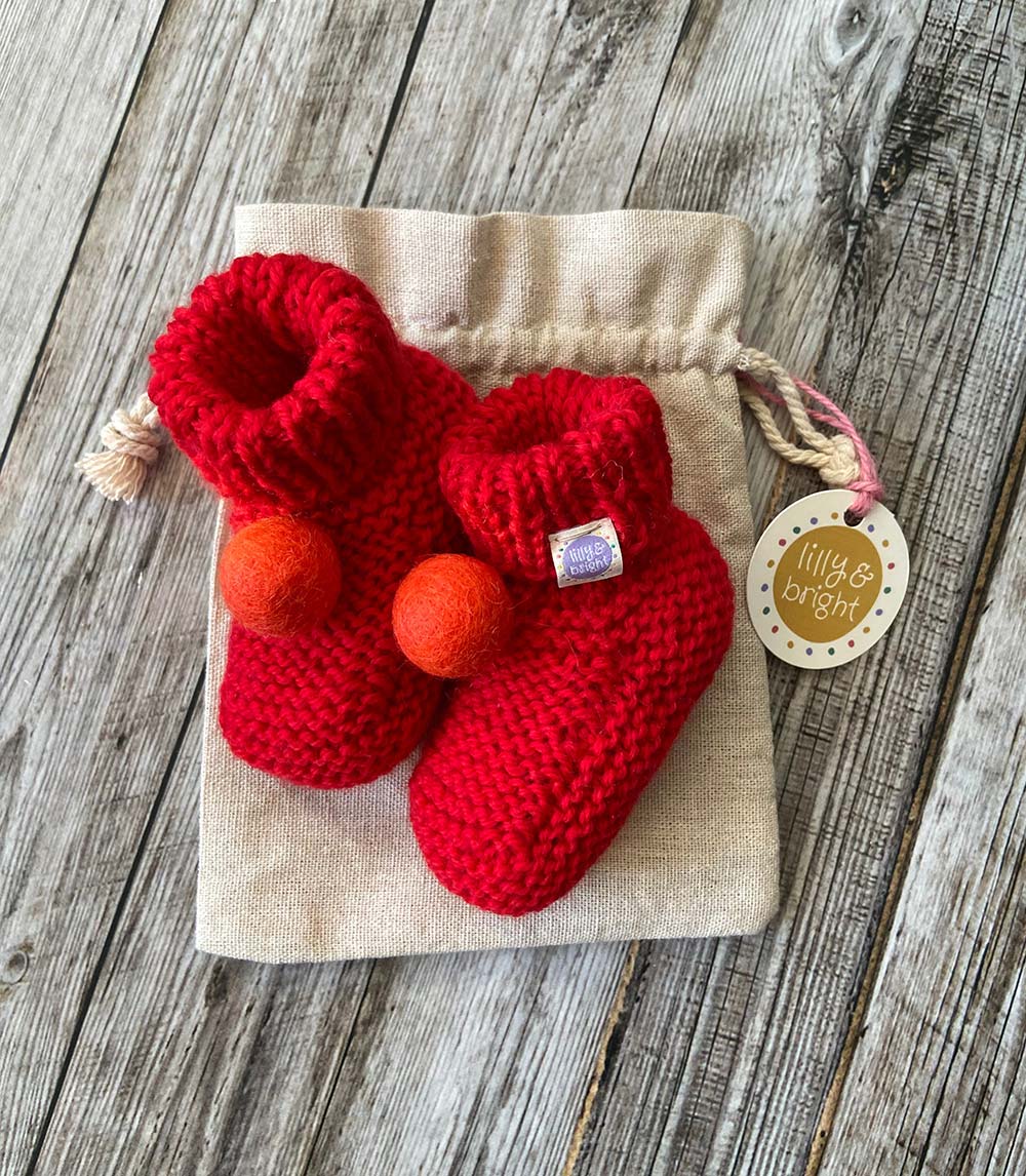 Hand knit Red Baby Booties by Lilly and Bright with pom pom and drawstring bag