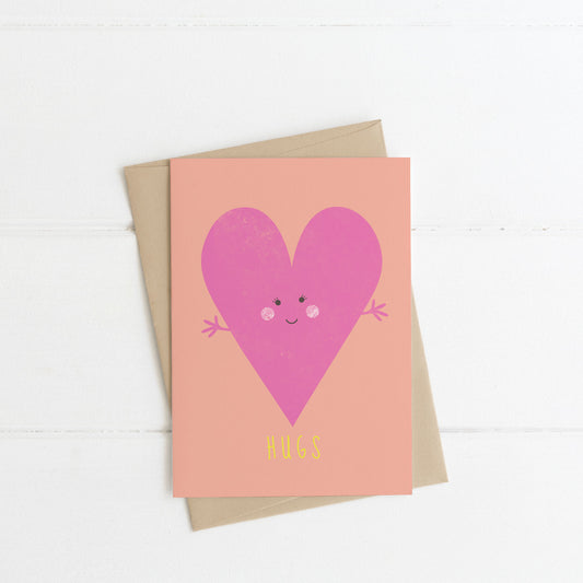 A6 cute pink heart card with hugs written below the heart