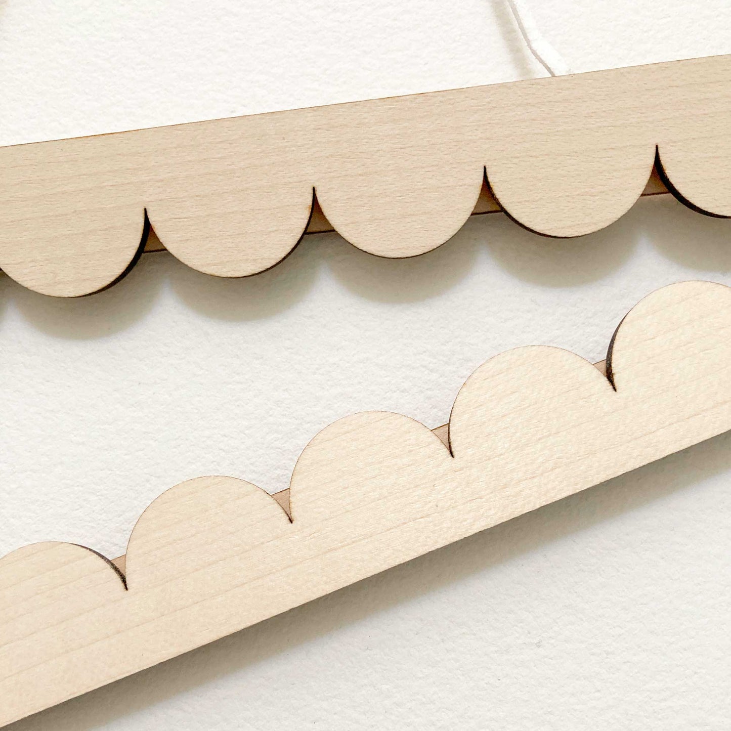 A3 scallop edged poster hanger detail
