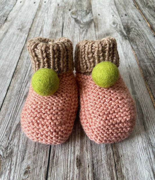 Hand knit Pink Baby Booties by Lilly and Bright with green pom pom