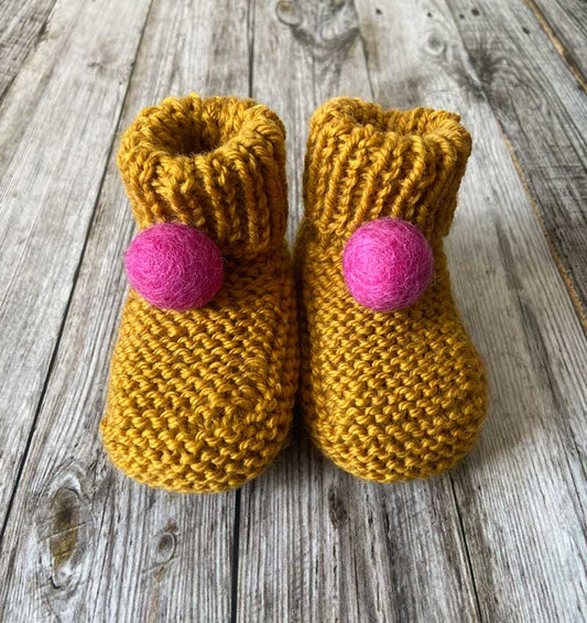 Mustard Baby Booties with pink pom pom by Lilly & Bright