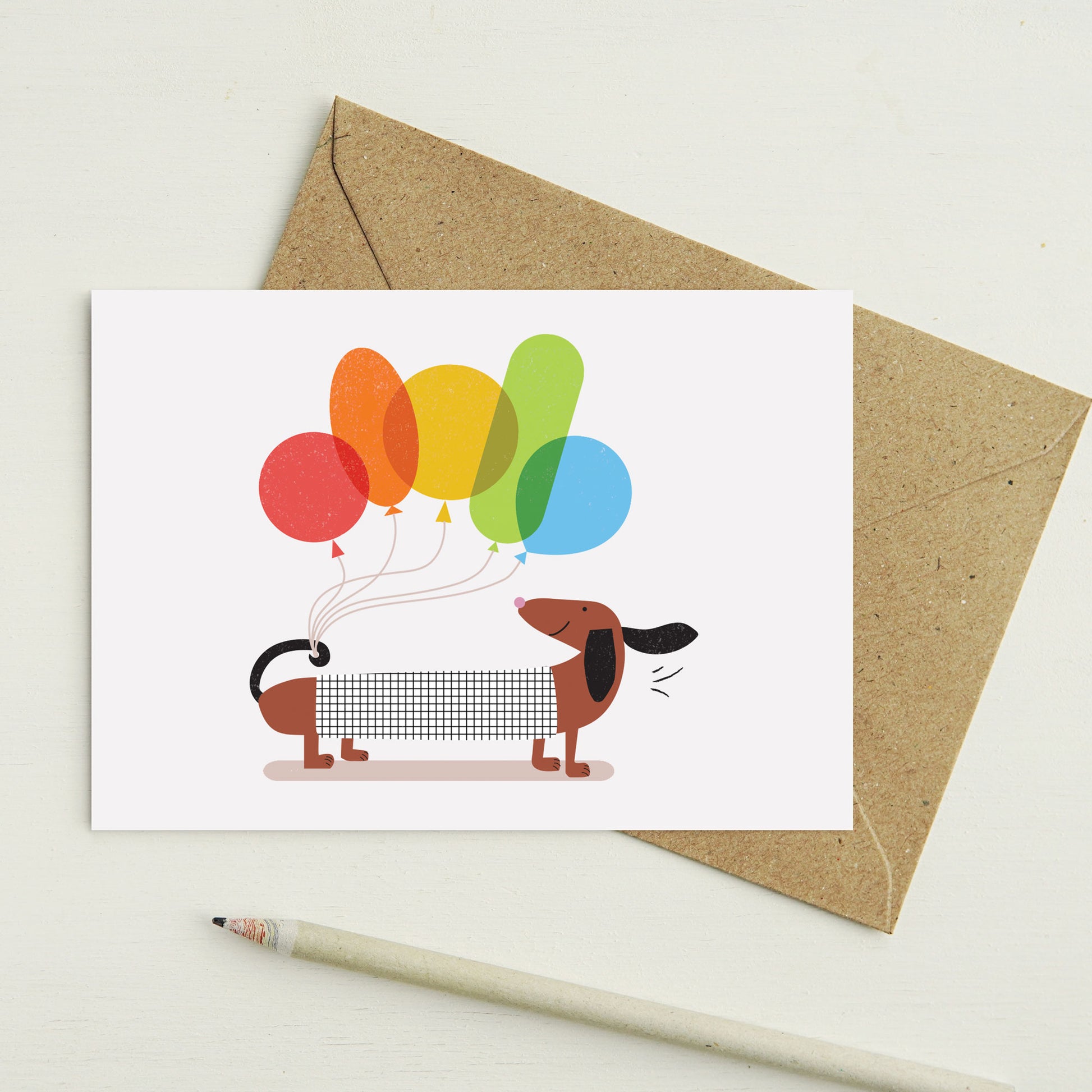 Lilly & Bright Sausage Dog with Balloons Greeting Card with a pencil