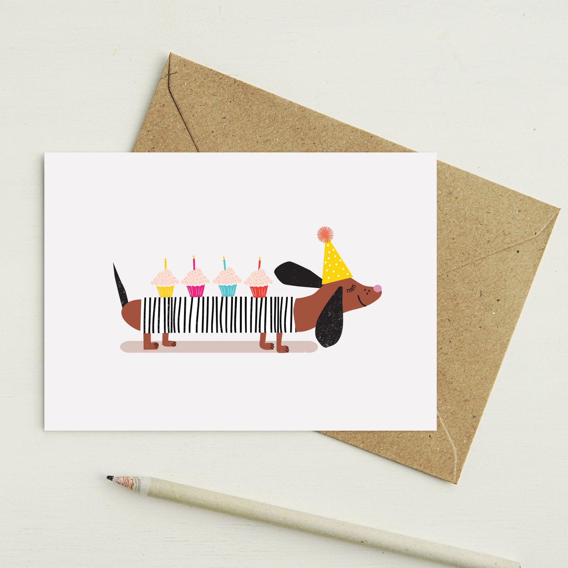 Lilly & Bright Sausage Dog with cupcakes Greeting Card with a pencil