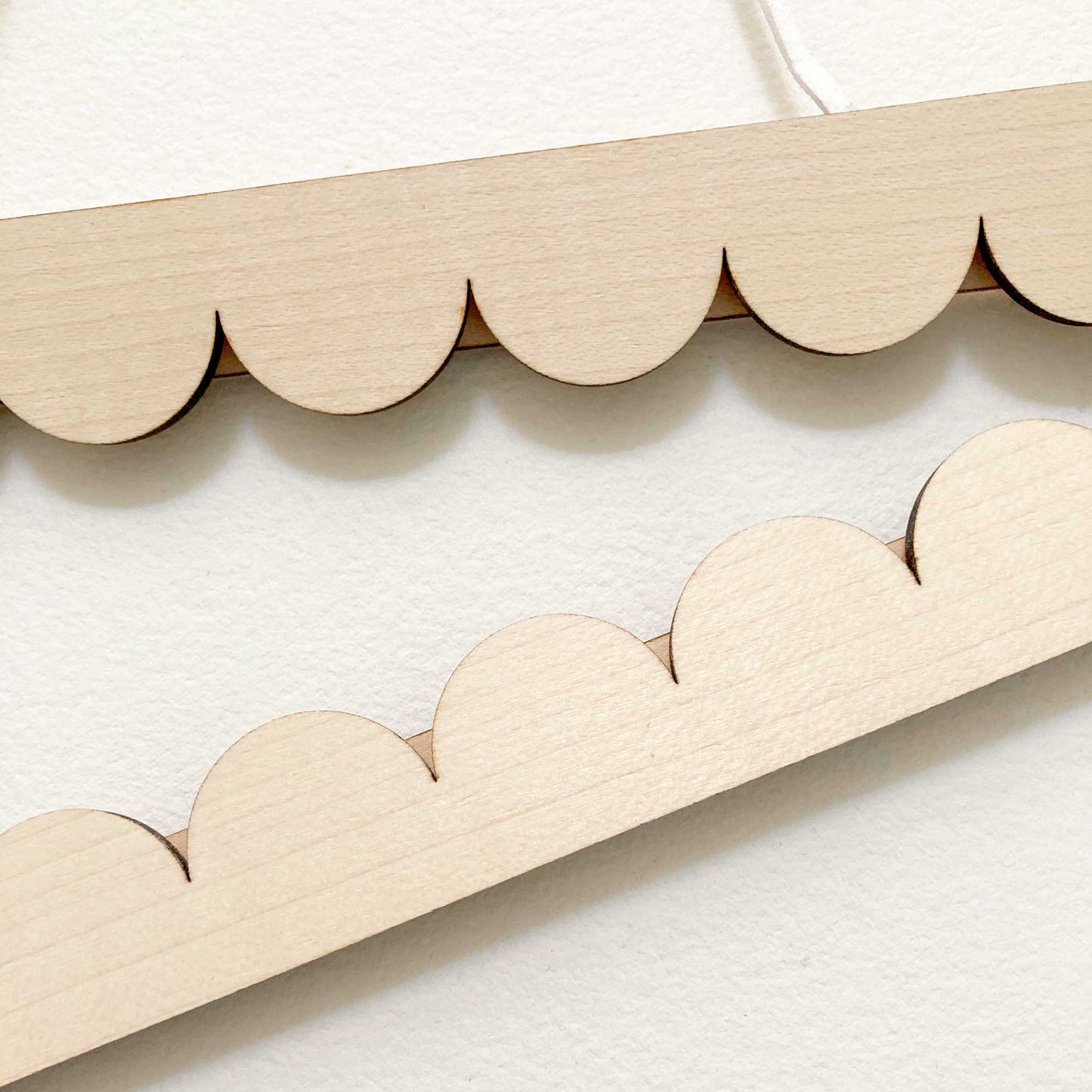 A3 scallop edged poster hanger detail